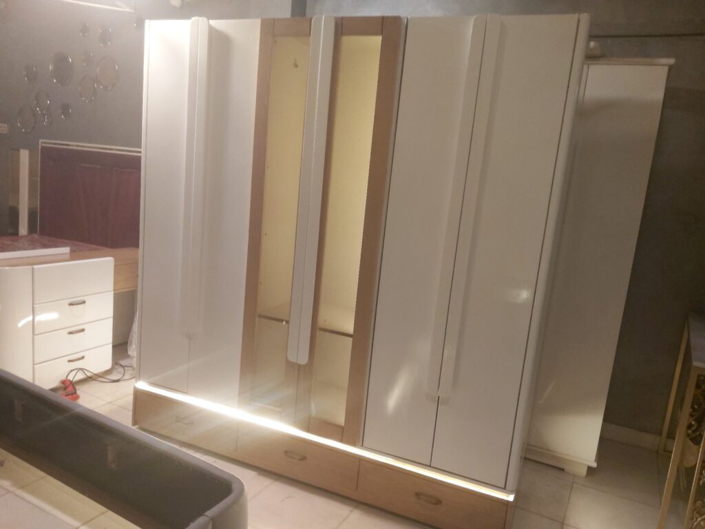 Modern wooden wardrobe along with lighting work