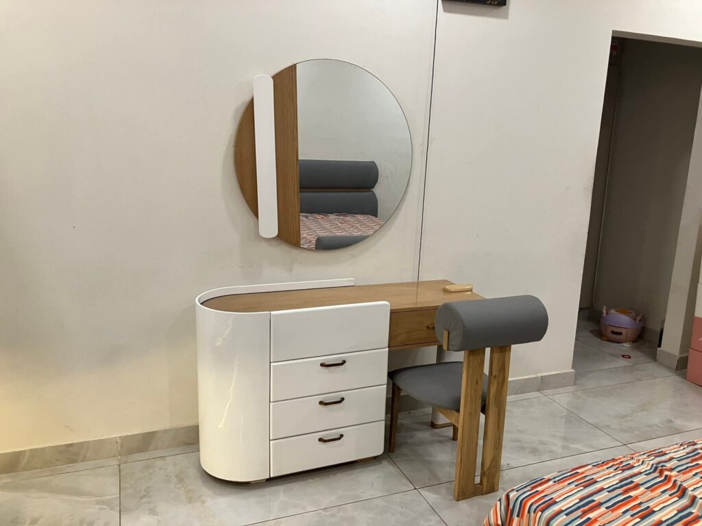 The modern wooden dresser along with chairs